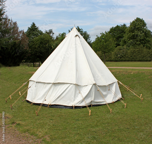 An Old Fashioned White Canvas Bell Camping Tent. © daseaford