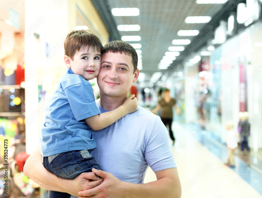 Father and child doing shopping