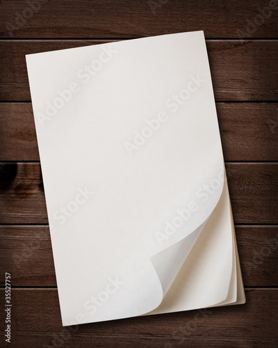 Notepaper on wooden table.
