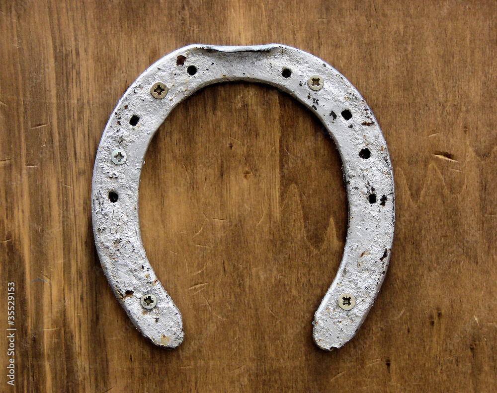 old horse horseshoe beaten on a wall old horse horseshoe beaten on a wall