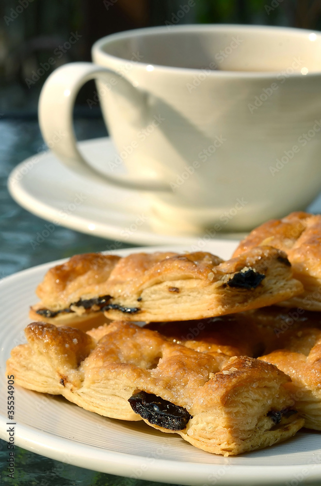 Tea Break with raisin pie biscuits in warm afternoon light Tea Break with raisin pie biscuits in warm afternoon light