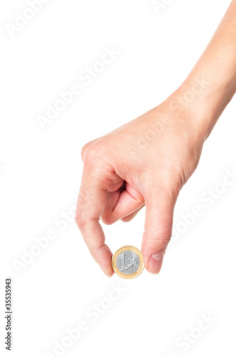 Hand holding 1 Euro coin