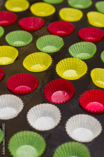 Vibrant cupcake wrappers (backing cups) in silicon/metal tray