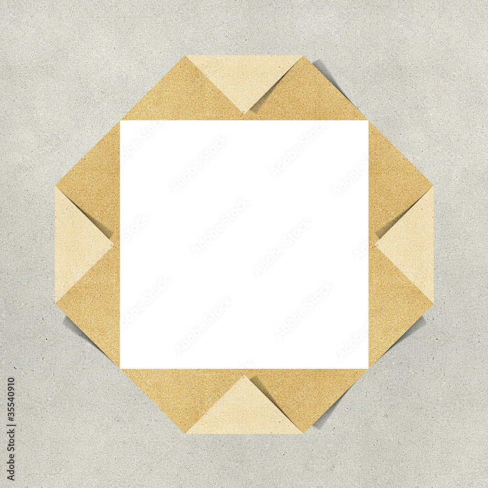 Fototapeta premium Hole ripped in recycled paper craft on white background