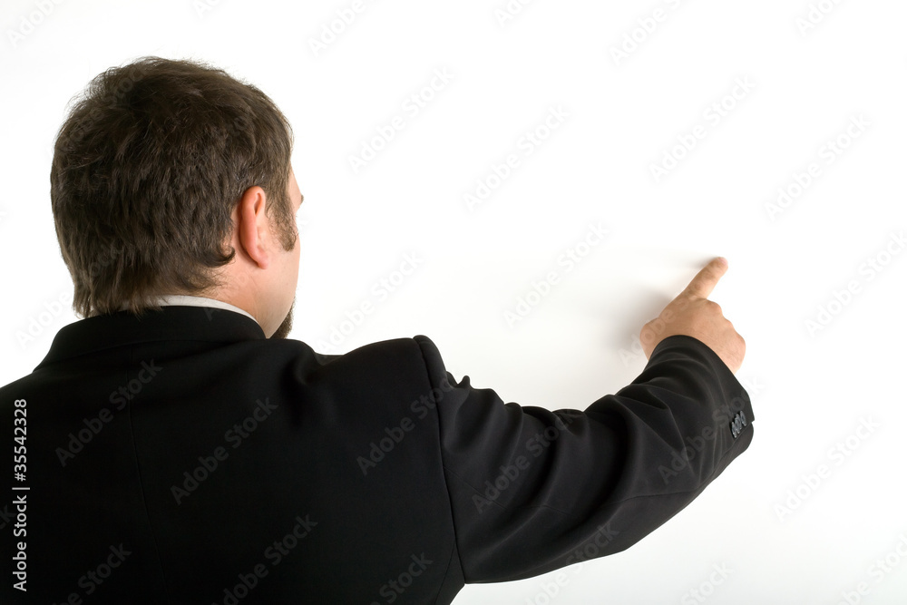Standing behind a man shows his index finger Standing behind a man shows his index finger