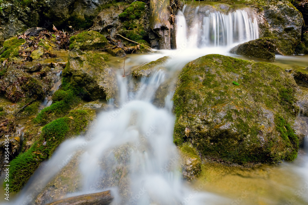 Fototapeta premium small waterfall on mountain stream