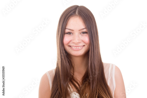 Portait of an attractive teenage girl smiling isolated