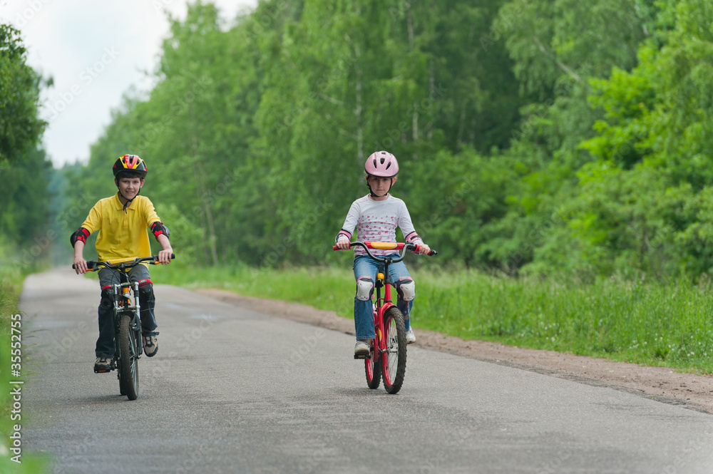 Naklejka premium Walk on bicycles