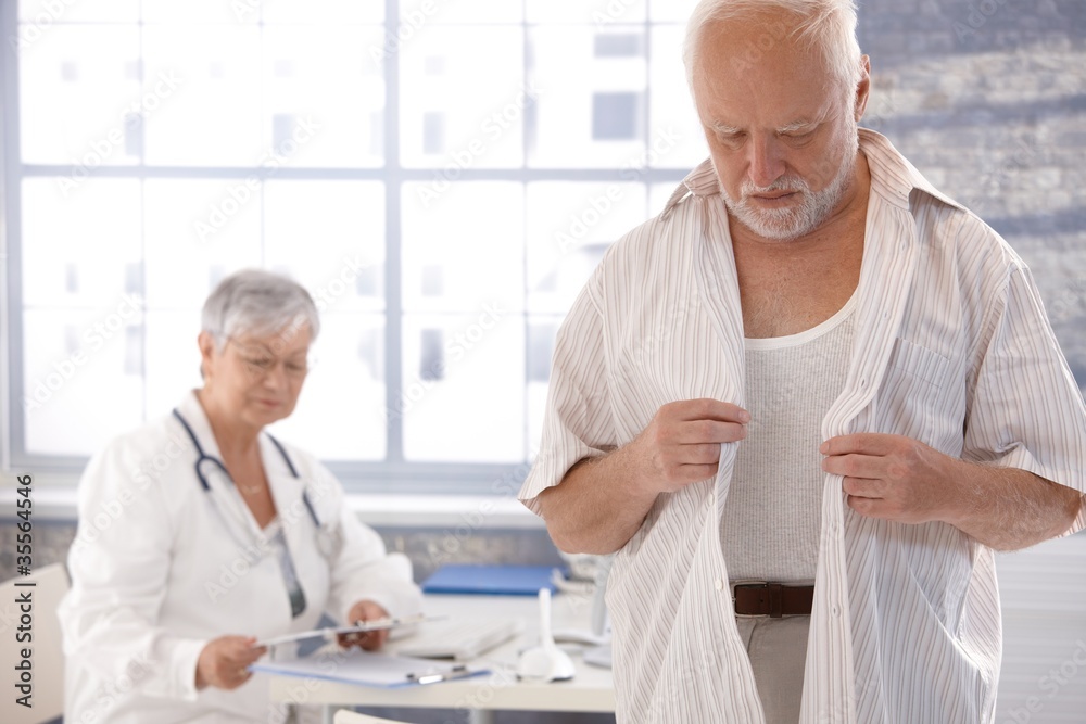 © nyul - Male patient undressing at doctor's room