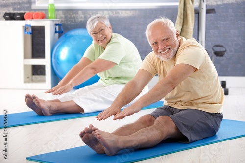 Elderly couple stretching