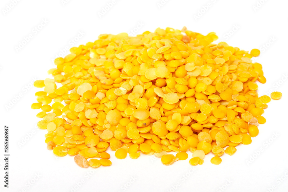 Yellow lentils isolated on white background.Macro shot Yellow lentils isolated on white background.Macro shot