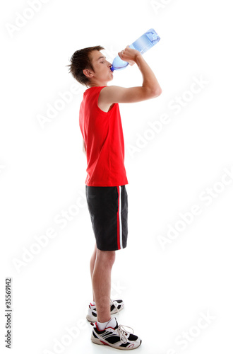 Sports person drinking water from bottle