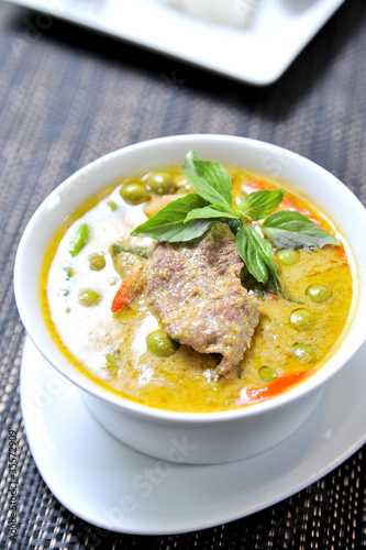 delicious thai food: green curry in a white bowl