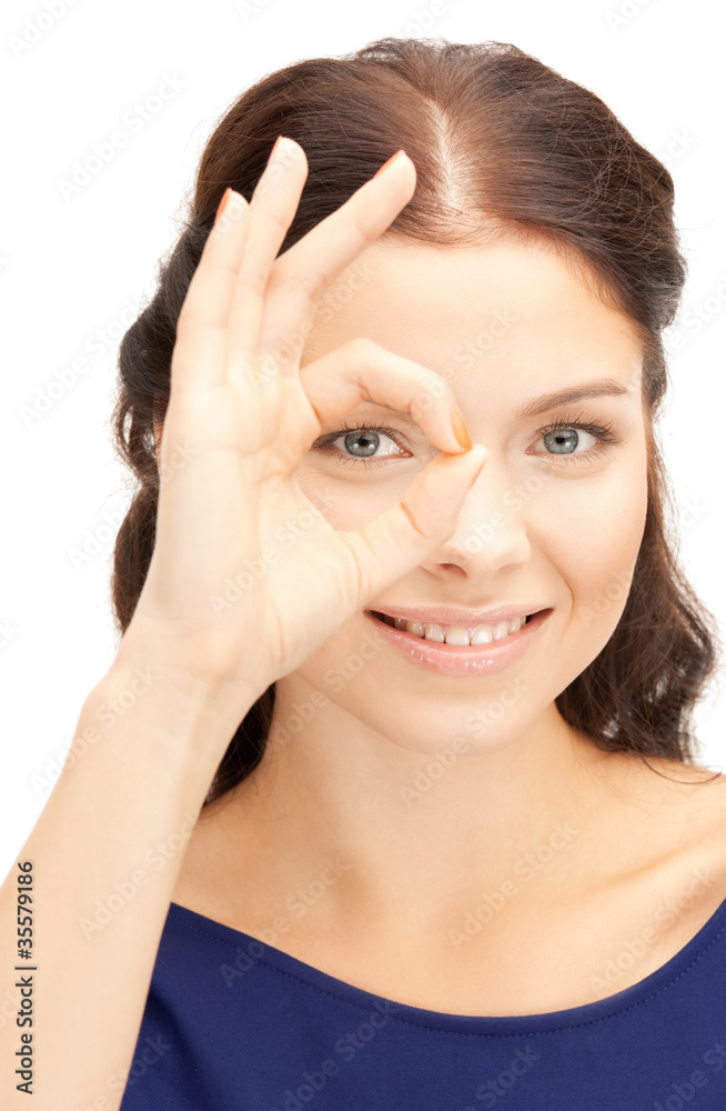 lovely woman looking through hole from fingers lovely woman looking through hole from fingers