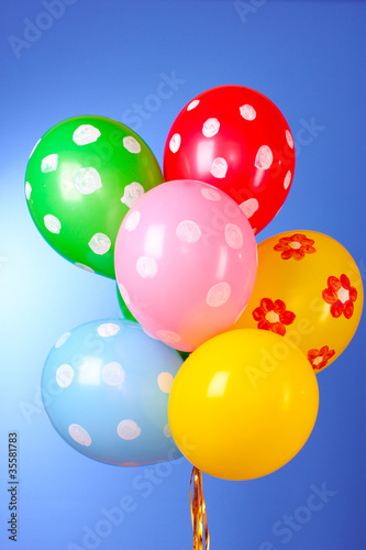 Flying balloons with polka dot on a blue background