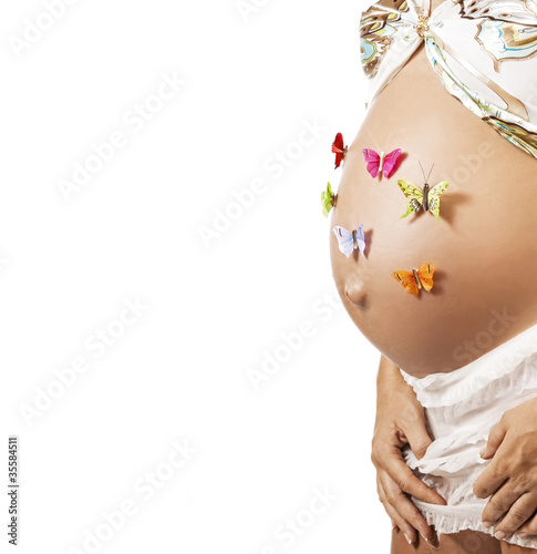 Pregnant woman with butterfies on her belly photo