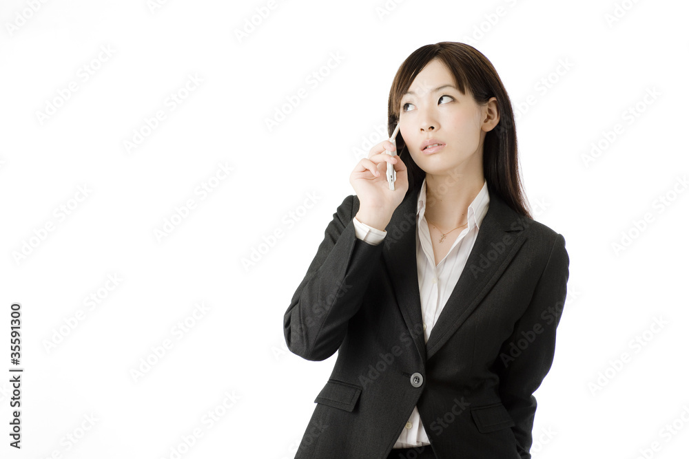 携帯電話と女性社員 携帯電話と女性社員