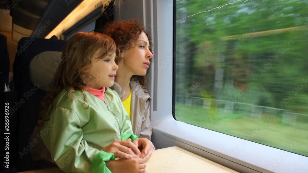 Mother with daughter ride in speeding train