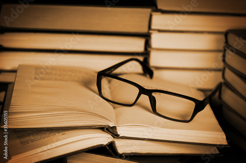 Glasses on open book.