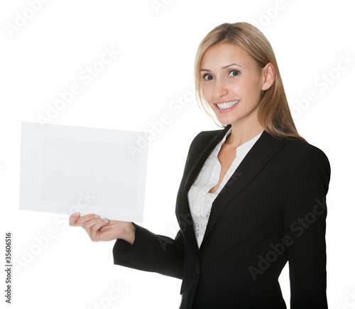 Confident businesswoman holding a blank card