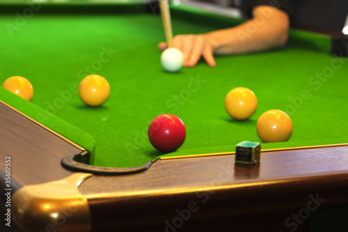 Pool game on green table