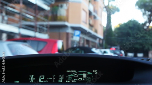 Driving inside car  through narrow streets in city