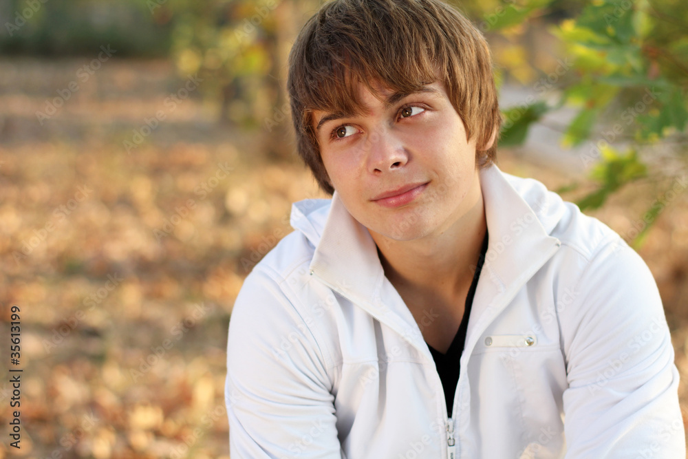 Portrait Of Young Man In Autumn Park, sunshine Portrait Of Young Man In Autumn Park, sunshine