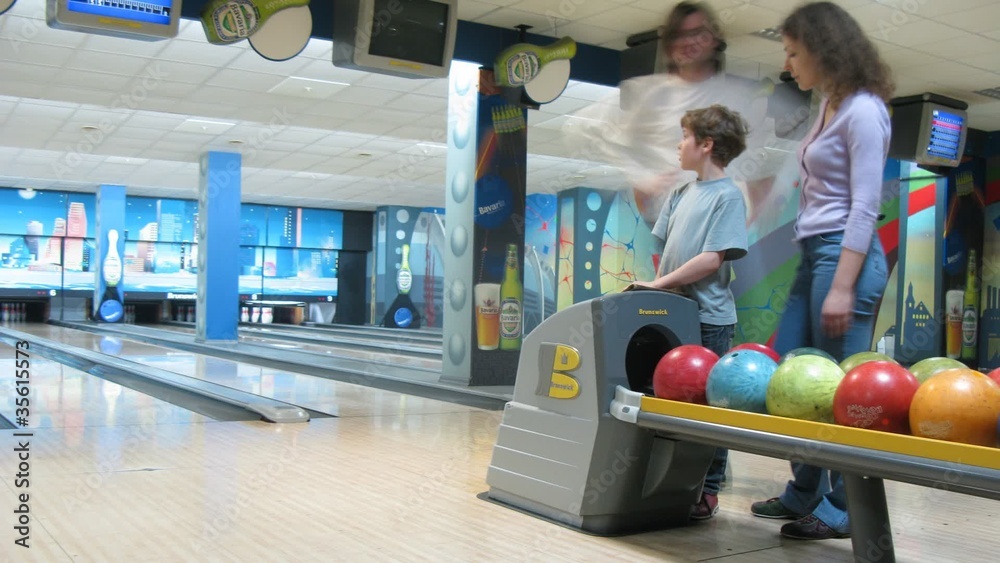 Family play bowling
