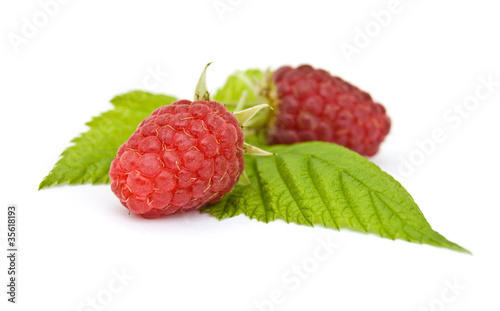 Fresh, ripe raspberries on white