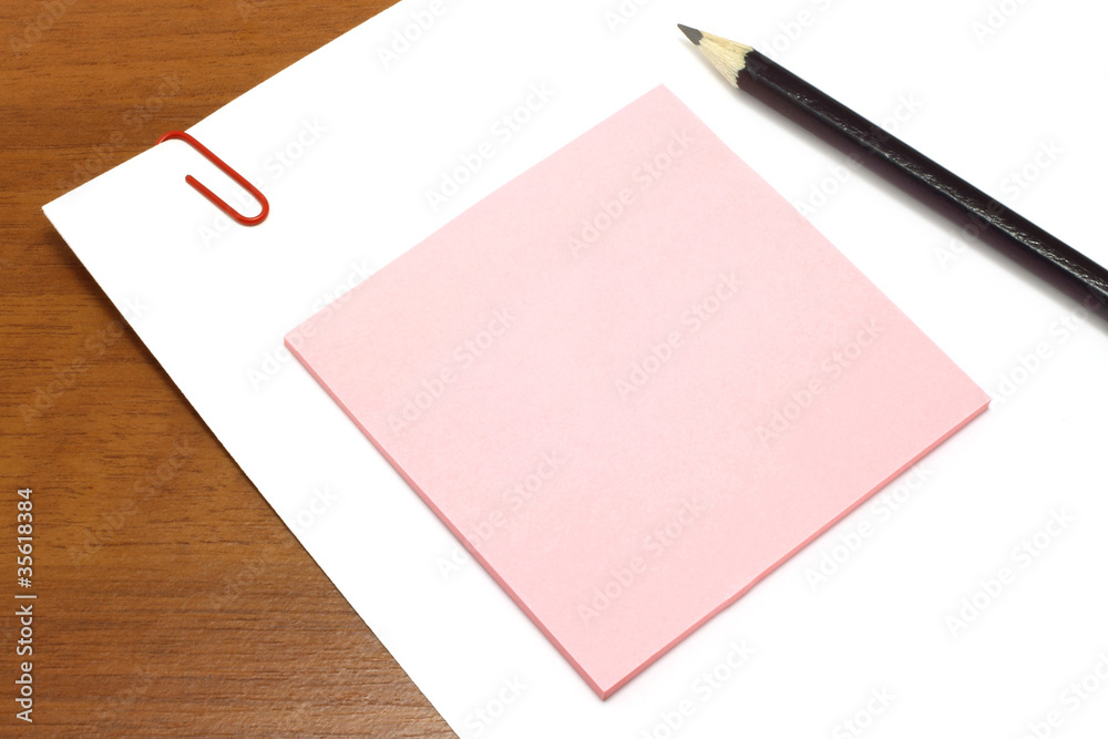 White and pink paper with pencil White and pink paper with pencil
