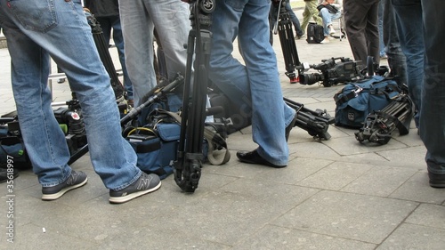 Legs of  cameramen photo
