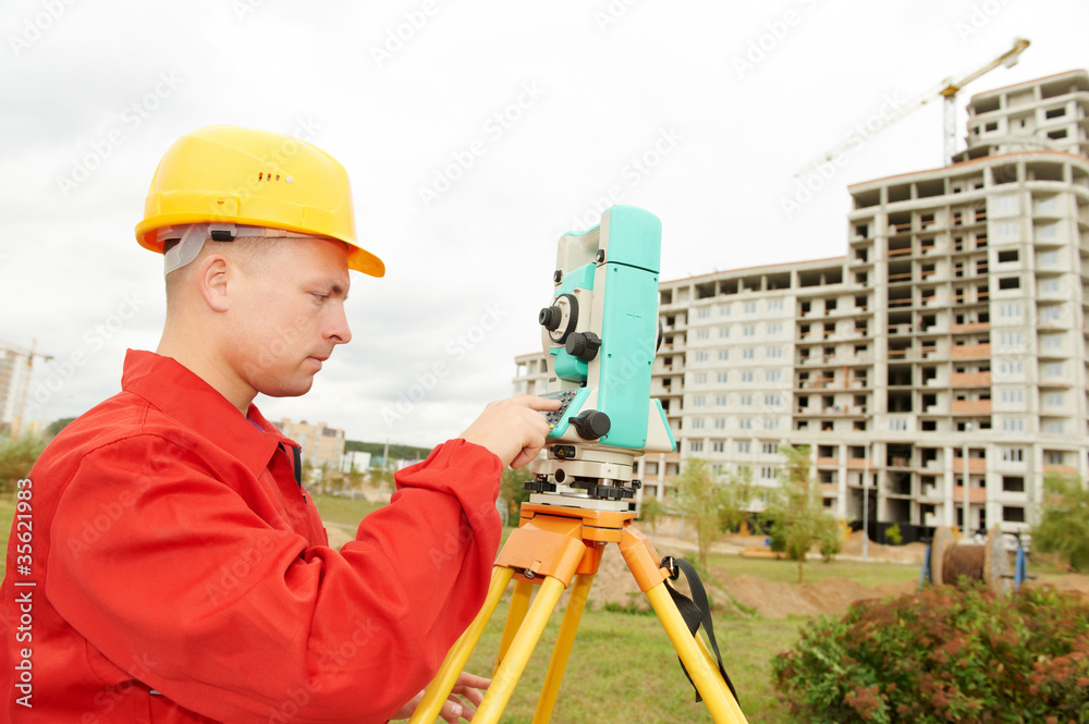 surveyor works with theodolite