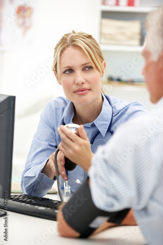 Young doctor with senior patient
