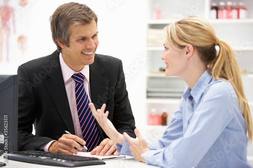 Doctor with female patient