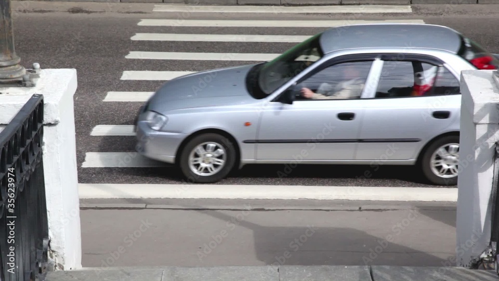 Several cars drove over pedestrian crossing at high speed Several cars drove over pedestrian crossing at high speed