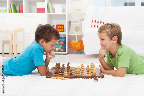 Two boys playing chess