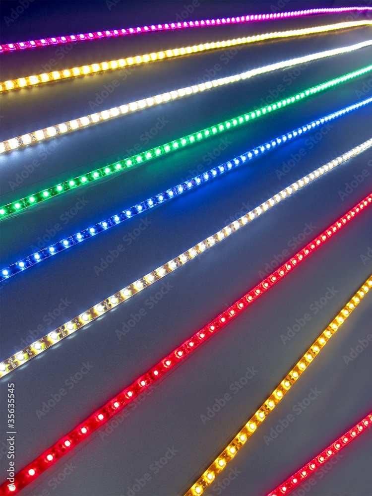 abstract led power lighting, holiday garland closeup, energy saving bulb lamp, rainbow color line diversity