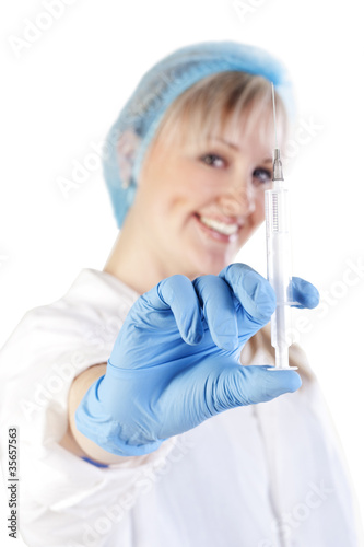 Pretty doctor holding a syringe