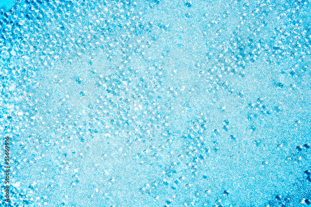 crystal glass pearls little balls texture on blue crystal glass pearls little balls texture on blue