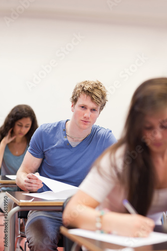 Portrait of young students having a test