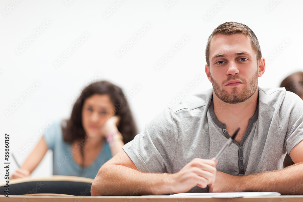 Smiling handsome student sitting Smiling handsome student sitting