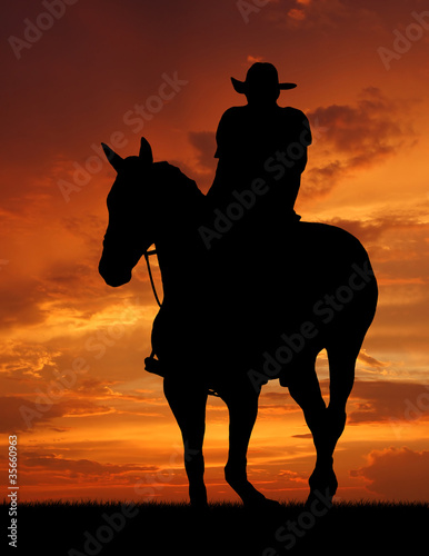 cowboy silhouette in sunrise © vencav