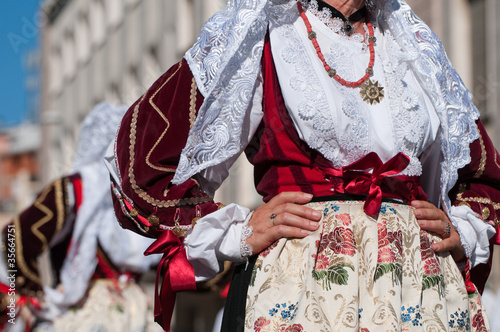 Sardinia, Italy: Redentore festival. Detail of a dress photo