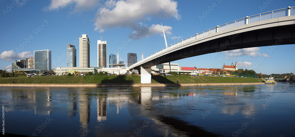 The Vilnius city walking bridge with skyscrapers
