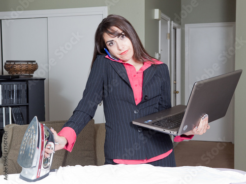 Stern Hispanic multitasking business woman housewife