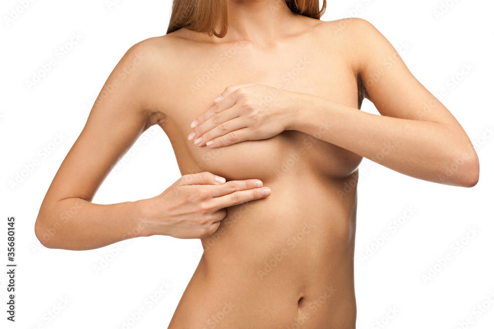 Woman examining her breast Woman examining her breast