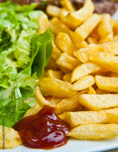 Golden French fries potatoes ready to be eaten