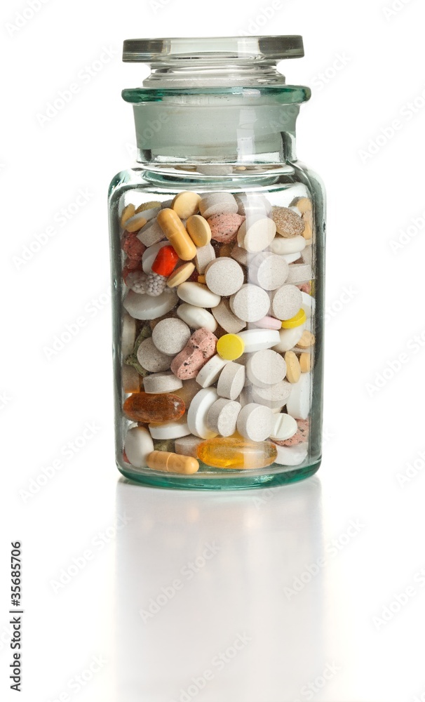 Full chemistry bottle with colorful pills Full chemistry bottle with colorful pills