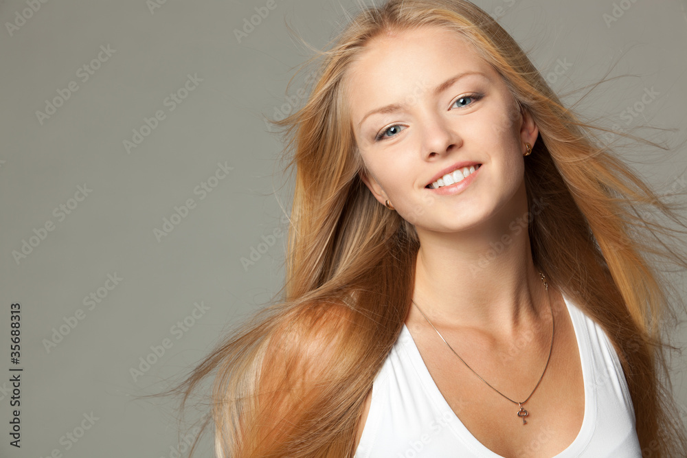 Fototapeta premium Close up portrait of smiling beautiful blond female