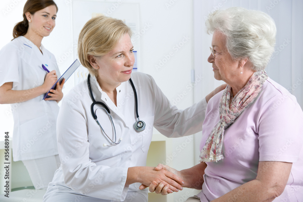 doctor explaining diagnosis to his female patient doctor explaining diagnosis to his female patient